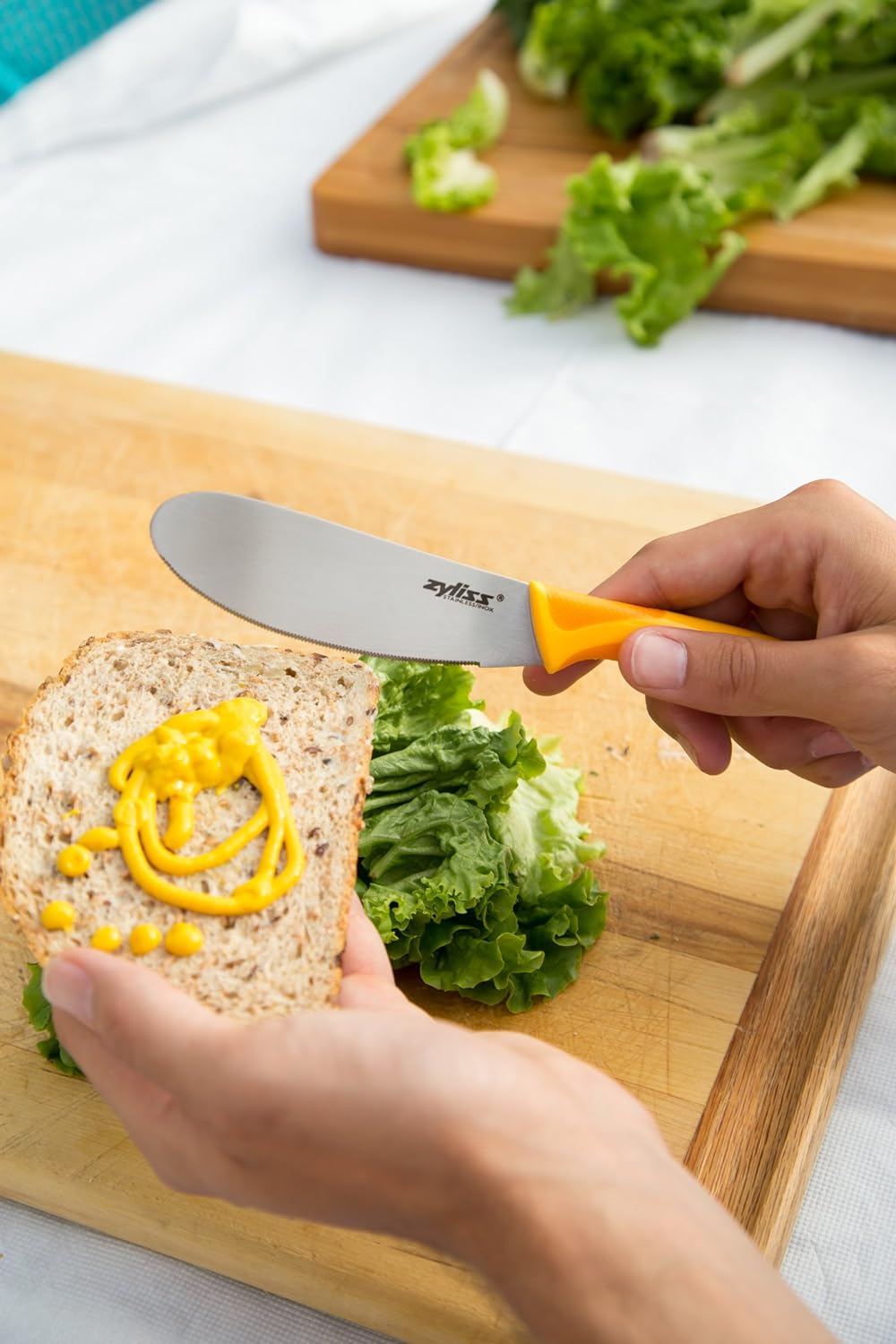 Zyliss Sandwich Knife & Condiment Spreader - Sandwich Spreader Knife for Butter, Cream Cheese, & Jellies - Ergonomic Stainless Steel Spreading Knife - Butter Spreader Knife for Bagels & Toast - Orange-4